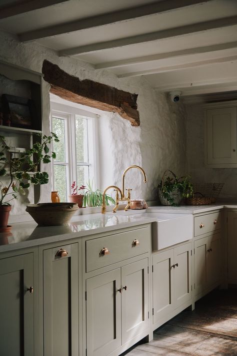 Have you been to visit our Cotes Mill showroom? This kitchen is perhaps the one that people are most excited to see, Shaker cupboards hand painted in ‘Mushroom’, handcrafted brass cupboard fittings, plenty of weathered beams and the wibbliest of walls! #deVOLKitchens #GreigeKitchen #ShakerCabinets Mushroom Kitchen Cabinets, Cottage Core Interior, Large Kitchen Window, Greige Kitchen, Country Cottage Kitchen, Country Cottage Interiors, Devol Kitchens, Stone Kitchen, Cottage Core Aesthetic