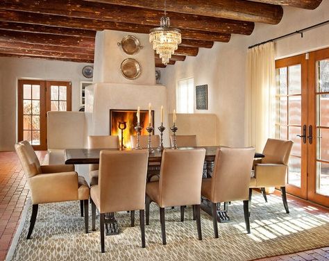 modernized Southwest style dining room by Violante & Rochford Interiors, photo credit © Wendy McEahern Santa Fe, Luxe Vacation, Kiva Fireplace, Sub Zero Appliances, Cabin Exterior, Santa Fe Style, Brick Flooring, Santa Fe New Mexico, Modern Fireplace