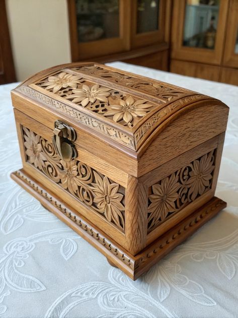 Discover the beauty of this intricately carved wooden chest, adorned with stunning floral designs and a secure metal latch. A true testament to skilled craftsmanship!   What pieces of woodwork inspire you? Share your favorites in the comments and let's celebrate the artistry of wood together! . #woodworking #wood #handmade #woodworker #woodwork #diy #design #smallbusiness #interiordesign #woodart Woodwork Diy, Wooden Chest, Woodworking Wood, Let's Celebrate, Wooden Art, Floral Designs, Diy Design, Wood Art, Wooden Boxes