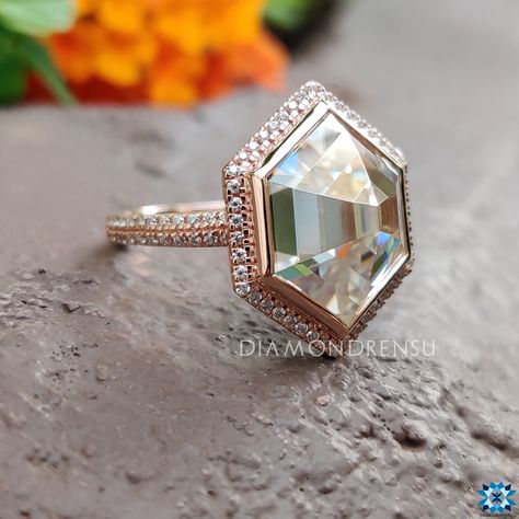 Embrace timeless elegance with our Hexagon Rose Cut Engagement Ring. Masterfully crafted, this piece features an antique cut moissanite, nestled within a hexagonal halo and a two-row pave band. The bezel setting enhances the step-cut stone, presenting a harmonious blend of classic charm and modern flair. Perfect for those seeking a unique, rose gold wedding ring, it embodies the essence of love and commitment. Experience the luxury of customizing your dream jewelry with us. The stones in the jew Round Diamond Hexagon Halo, Rose Cut Engagement Rings, Bezel Set Wedding Ring, Engagement Ring Bezel, Hexagon Engagement Ring, Propose Ring, Double Halo Engagement Ring, Double Halo Engagement, Customizable Jewelry