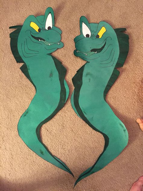 Eels from Little Mermaid I made for trunk or treat. Flotsam and Jetsam Ursula’s Eels, Ursula Door Decoration, Ursula Decorations Diy, Trunk Or Treat Ursula, Flotsam And Jetsam Diy, Little Mermaid Hallway Decorations, Little Mermaid Homecoming Float, Ariel Trunk Or Treat Ideas, Ursula Party Food