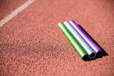 Relay baton on running track. In stadium #Sponsored , #ad, #PAID, #baton, #track, #running, #Relay Relay Baton, Relay Batons, Track Running, Relay Races, Running Track, On Running, Presentation Design, Presentation, Stock Images