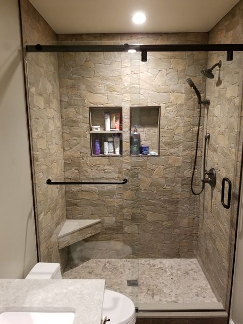 Natural Stone In Bathroom, Stone Tile Shower Wall, Small Stone Shower Ideas, Shower Remodel Brown Tones, Bathroom Floor And Shower Tile Combos, Shower Rock Tile Ideas, Farmhouse Master Bathrooms With Walk In Showers, Rock Floor Shower Tile, River Rock Tile Shower Floor