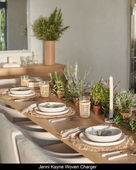 Woven Charger Natural Add a touch of texture to the table when you place chargers under dinner plates at every setting. This jute charger is beautiful, durable, and perfect for any occasion. 100% jute charger. Made in Bangladesh. | Jenni Kayne Woven Charger Crate And Barrel Tablescape, Dining Table Settings Ideas, Jenni Kayne Table Setting, Rattan Table Setting, Woven Chargers Table Settings, Rattan Charger Wedding, Dinner Party Table Settings Casual, Table Settings Casual, Natural Table Settings