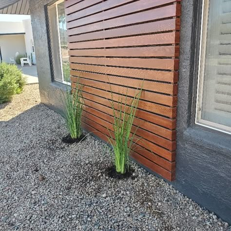 Wood exterior panel Exterior Wood Slat Accent, Wooden Accent Exterior, House Planters Outdoor, Cedar Planks On Exterior, Windowless Exterior Wall Ideas, White Black And Natural Wood House Exterior, Exterior House Stain Color Combinations, Front House Wood Accents, Wood Siding Accent Exterior