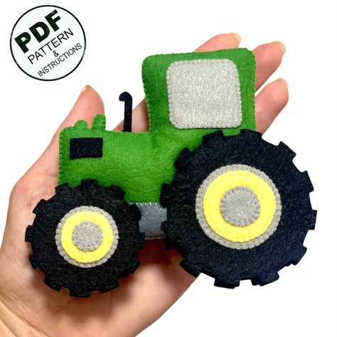 PDF sewing pattern for Tractor. This PDF hand sewing pattern will give you a pattern and step by step instruction to make a Felt Tractor. All instructions are written in English. Also, in the PDF file you will find links to videos (YouTube), in which all the stitches we use are filmed in detail. - This listing is for an instant-download (PDF PATTERN) - This is not a finished toy. Our store sells exclusively patterns and instructions for hand-sewing toys. Any materials and tools are also not incl Felt Mailbox Pattern, Tractor Felt Ornament, Felt Tractor Pattern, Felt Vehicles, Felt Tractor, John Deere Crafts, Sew Toys, Felt Toys Patterns, Felt Crafts Christmas