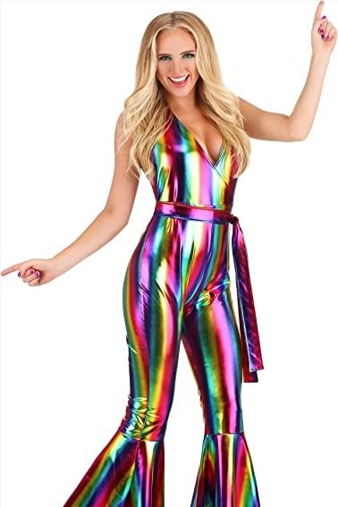 Get ready to boogie the night away in this rainbow rave outfit for women. This jumpsuit features a mock-wrap bodice that has halter ties made of the same fabric. The pants portion has a concealed back zipper to help get the jumpsuit on and off. The pant legs flare widely below the knees for that classic 70s look. Elton John Costume Women, 70s Theme Party Outfit For Women, 70s Costume Ideas, Disco Theme Party Outfit, Disco Costume For Women, Disco Party Costume, Pride Dress, Disco Party Outfit, Rave Halloween