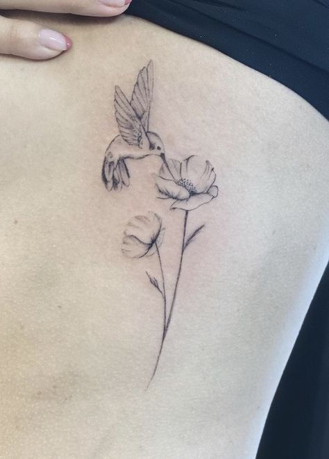 Tattoo Simple Hummingbird And Flower Tattoo, Poppy Flower And Hummingbird Tattoo, Hummingbird Drinking From Flower Tattoo, Hummingbird Poppy Tattoo, Hummingbird Mother Daughter Tattoos, Hummingbird With Birth Flowers Tattoo, Poppy And Hummingbird Tattoo, Dainty Hummingbird Tattoo With Flowers, Hummingbird And Carnation Tattoo