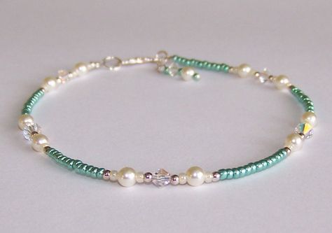 Handmade beaded anklet by Sapphire Rain Designs created with Swarovski "cream" pearls, Swarovski "clear ab" crystals, shiny green glass seed beads, and sterling silver beads, findings and clasp.  9 1/2 " in length.  Comes in gift box. How To Make Small Beaded Bracelets, Beaded Ankle Bracelets Diy, Hip Beads, Glass Bead Anklet Ideas, Silver Beads Bracelet, Green Beeds Jewelery, Handmade Green Beaded Bracelet, Green Beaded Pearl Bracelet As A Gift, Beads Anklets Ideas