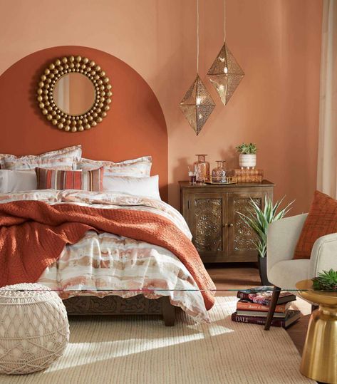 Earthy Explorer Bedroom - Home - The Home Depot Colorful Spare Bedroom, Rust Orange Bedroom Walls, Peach And Brown Bedroom, Boho Bedroom Orange And Green, Teroccata Bedroom, No Headboard Ideas Bedroom Boho, Colored Wall Bedroom, Sedona Bedroom Decor, Orange And Tan Bedroom