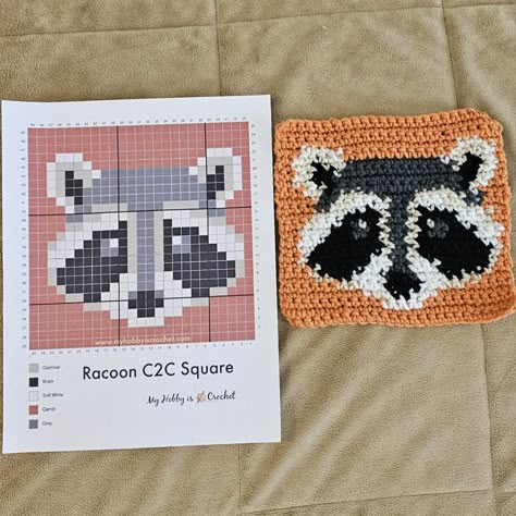 Crochet Raccoon Applique, Raccoon Granny Square, Crochet Grid Patterns Halloween, Gamer Crochet Ideas, What To Crochet With Black Yarn, Crochet Raccoon Free Pattern, What To Crochet Ideas, Small Tapestry Crochet Pattern, Raccoon Pixel Art