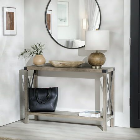 Light and relaxed is how all your guests will feel upon encountering the Magnolia Metal X Grey Wash Entry Table by Walker Edison in your hallway. You will also feel its calming effects when used in any room of the house, whether living room, kitchen, or bedroom. This sofa table gives the opportunity to display your new house plants or other decoration while also providing a storage shelf out of the line of sight. A table like this can change how you organize your home no matter where it is place X Console Table, Console Table Modern, Black Console Table, Console Table Hallway, Organize Your Home, Square Side Table, Walker Edison, Lift Top Coffee Table, Black Side Table