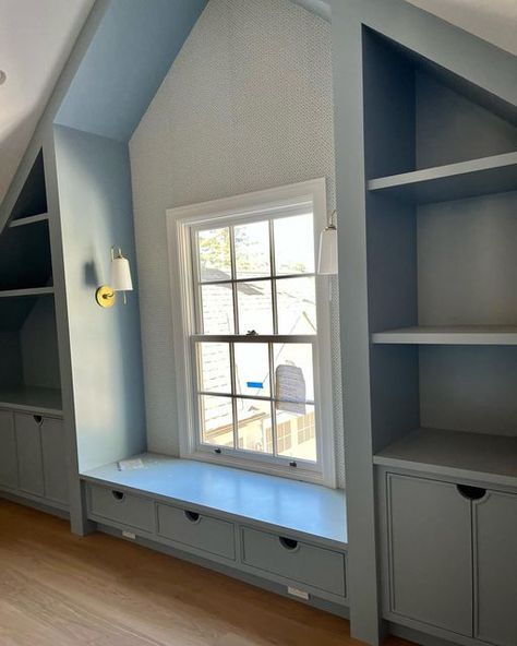 Finished Attic Living Room, Bonus Room Bookcases, Attic Accent Wall Ideas, Under Eaves Playroom, Attic Bedroom Ideas Wallpaper, Bookshelf In Attic Room, Angled Upstairs Bedroom, Playroom With Sloped Ceiling, Window Seat Slanted Ceiling