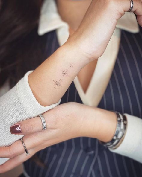 Fine line stars tattoo on the wrist. 3 Stars Tattoo Wrist, Line Stars Tattoo, Stars Wrist Tattoos For Women, Stars In A Line Tattoo, Stars With Initials Tattoo, Wrist Fine Line Tattoos For Women, Fine Line Tattoo Ideas Stars, Fine Wrist Tattoo, Fineline Wrist Tattoos For Women