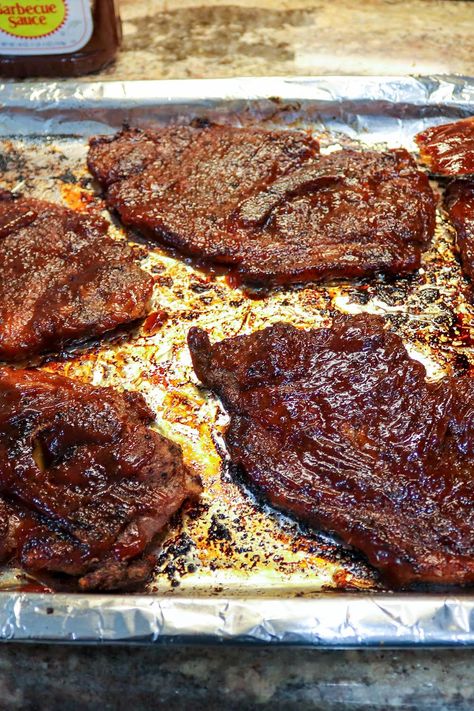 Oven Baked BBQ Pork Steaks Oven Bbq Pork Steaks, Pork Steak Cast Iron Skillet, Pork Steak Meals Dinners, Tender Pork Steak Recipes Oven, Broiled Pork Steaks In Oven, Bake Pork Steaks In Oven, Baked Pork Shoulder Steak, Keto Pork Steak Recipes, Pork Shoulder Steak Recipes Oven Baked