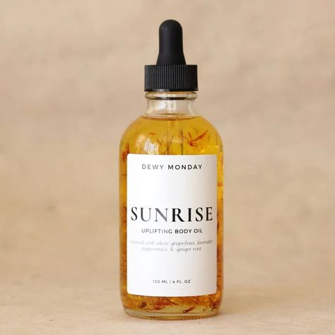 Awaken your senses and embrace the new day with this aromatic, herbal elixir infused with a harmonious blend of mood-elevating essential oils. Made with a lightweight plant-based formula that effortlessly absorbs into your skin, this antioxidant-rich body oil is a nourishing and revitalizing experience for your body with none of the oily feeling. Smells like: an energizing blend of grapefruit, peppermint, lavender, and ginger STORAGE + USE Recommended for all skin types. Always do a patch test to make sure no allergies exist to this product.  Store in a cool, dark place and use within 9 months. THE RITUAL: Apply it onto freshly damp or wet skin out of the shower to allow for quick and easy absorption that will lock in essential moisture. Revel in the relaxation of the aromatherapy and mass Essential Oils Packaging, Body Oil Packaging, White Grapefruit, Lavender Products, Skincare Lifestyle, Herbal Shop, Womens Perfume, Moisturizing Body Oil, Herbal Elixir