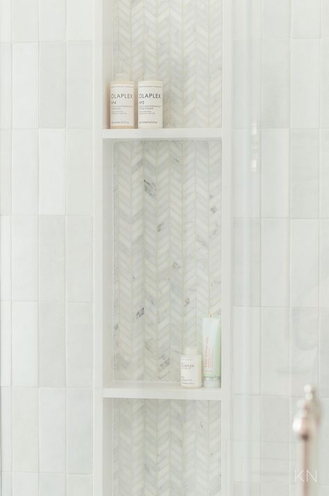 Shower Room Niche Ideas, Long Vertical Shower Niche, Large Shower Niche With Shelves, Stacked Shower Niche Ideas, Tile Showers With Niches, Honed Marble Shower Tile, Offset Shower Niche, Niche On Shower Head Wall, Small Bathroom With Chandelier