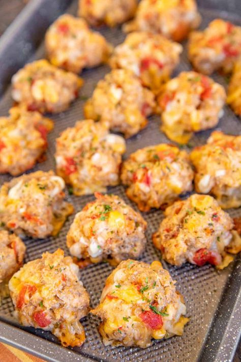 Rotel Cream Cheese Sausage Balls - a kicked-up version of our famous sausage balls! Only 5 ingredients - sausage, Bisquick, cream cheese, Rotel diced tomatoes and green chiles, and Mexican cheese blend. Can make in advance and freeze for a quick snack later. Great for breakfast, brunch, lunch, an appetizer at parties, and afternoon snacks. Whip up a batch ASAP! Title Cream Cheese Sausage Balls, Sausage Balls With Rotel, Rotes Cream Cheese Sausage Balls, Mexican Sausage Balls, Saturday Football Food, Debate Watch Party Food, Easy Pick Up Appetizers, What To Make With Pork Sausage, 8 Oz Cream Cheese Recipes