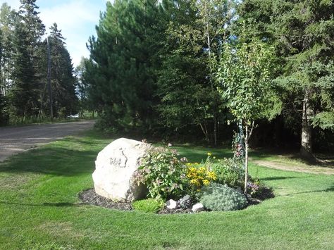 flower beds around signs | here's the flower bed at the front of the property with the house ... Rock Flower Beds, Garden Front Of House, Landscaping Around House, Landscaping With Boulders, Driveway Landscaping, Landscaping Front Yard, Front Landscaping, Landscaping With Large Rocks, In Front Of House