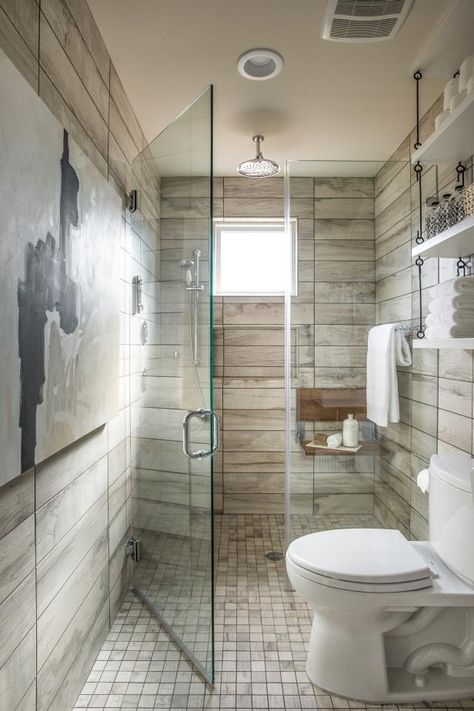 Floor-to-ceiling tile and a walk-in shower, this full bathroom serves the guest bedroom and acts as the downstairs bathroom for visitors.  From the experts at HGTV.com. Universal Design Bathroom, Wood Tile Shower, Small Farmhouse Bathroom, Wood Tile Bathroom, Bathroom Design Small Modern, Farmhouse Bathroom Decor Ideas, Modern Small Bathrooms, Decor Baie, Small Bathroom Design