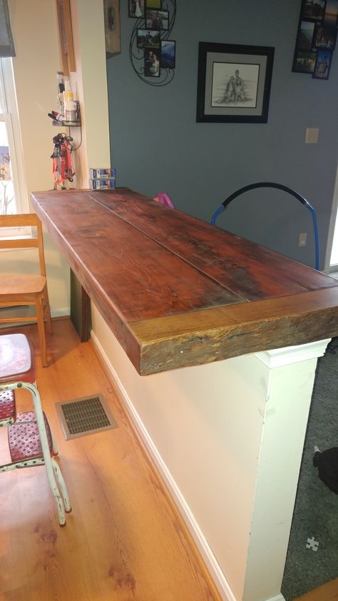 Our Half wall turned into a bar! Reclaimed wood bar top! Turn Half Wall Into Breakfast Bar, Halfwall Shelf, Half Wall Shelf Ideas, Half Wall Topper Ideas, Half Wall Breakfast Bar, Half Wall Countertop Bar, Wood Bar Top Ideas, Half Wall Bar Top, Half Wall Shelf