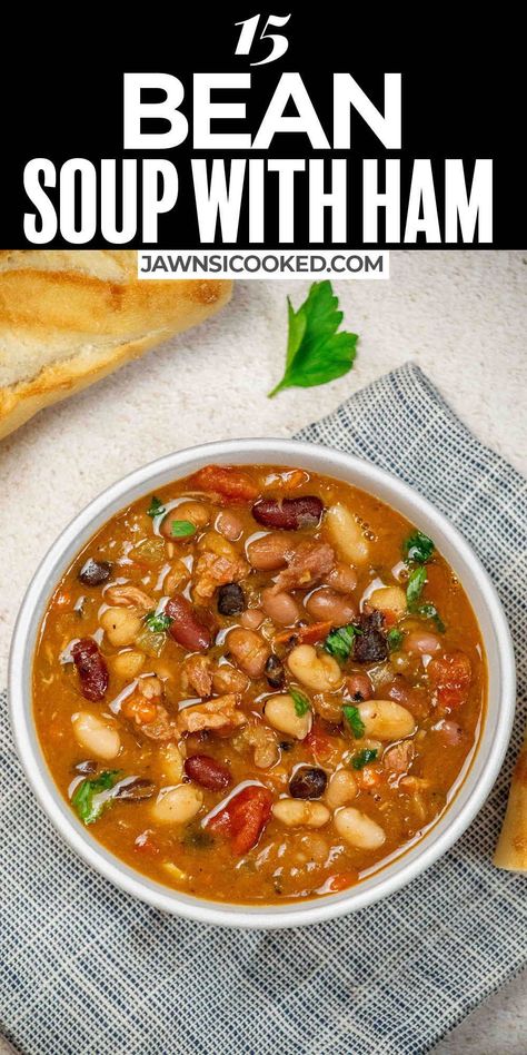 This Easy Traditional 15 Bean Soup with Ham Recipe is a hearty bowl of comfort food perfect for a cool winter's evening. Loaded with flavor, this stick to your ribs bean soup can be made with ham hocks, or is a great way to use up that leftover holiday ham bone! Crockpot Ham And Bean Soup With Ham Bone, 15 Bean Ham Bone Soup, 15 Bean Ham Soup, 15 Bean Soup With Ham Hocks, Ham Hock And Bean Soup Recipes, Ham Hawk And Bean Soup, Ham And Pinto Bean Soup Recipes, Ham Hock Bean Soup, Ham Stock Soup Recipes