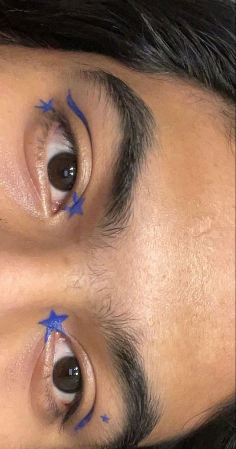 Blue Liner Looks, Blue Star Eye Makeup, Graphic Eyeliner Star, Eyeliner Stars Makeup, Face Eyeliner Art, Star Eyeliner Looks, Blue Graphic Liner Makeup, Eyeliner Art Makeup, Eye Star Makeup