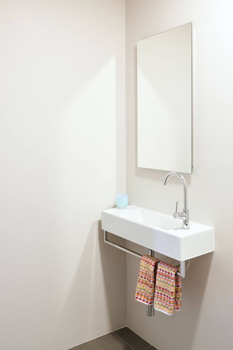 Suburban-Staid No More: A Stylish New California-French Look for a Bay Area House Wall Mounted Sink Powder Room, Sink With Towel Bar, Tiny Bathroom Sink, Wide Oak Flooring, Tiny Powder Room, Powder Room Sink, Black Floor Tiles, Midcentury House, Folding Glass Doors