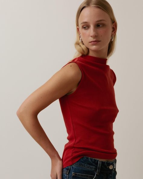 Sleeveless mock neck top in Poppy red. Cut from soft pointelle jersey. Lyocell and organic cotton. #afterallstudio #afterall #soft #tshirt #jersey #organiccotton #lyocell Shirt Silhouette, Sleeveless Mock Neck, Poppy Red, Mock Neck Top, Red Poppies, Mock Neck, Poppies, Girl Fashion, Organic Cotton