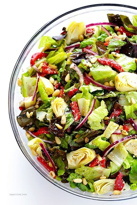 Our Family's Favorite Salad is made with lots of artichoke hearts, roasted red peppers, toasted pine nuts, and a zesty Parmesan vinaigrette. SO delicious, and always a crowd pleaser! | gimmesomeoven.com Family Salad, Pine Nuts Salad, Artichoke Salad, Spring Veggies, Paleo Salads, Green Salad Recipes, Favorite Salad, Gimme Some Oven, Artichoke Recipes