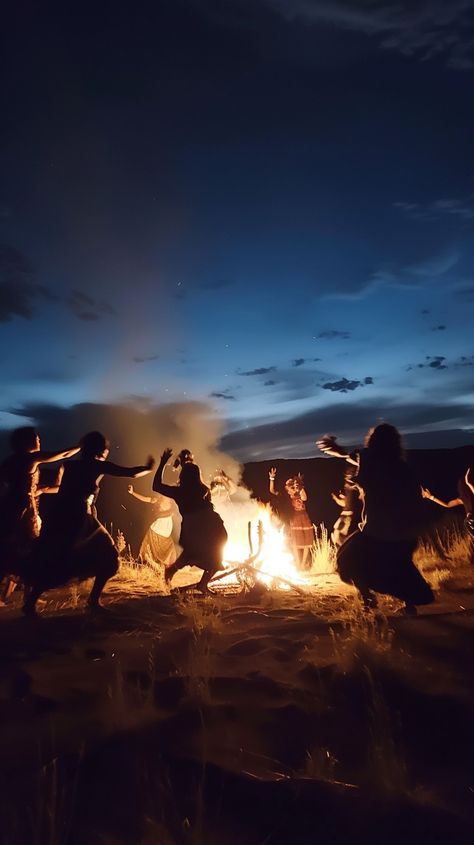 Dancing by Firelight: Silhouetted figures dance energetically around a roaring campfire under the twilight sky, celebrating the night. #dancing #campfire #twilight #silhouette #figures #celebration #night #fire #aiart #aiphoto #stockcake https://ayr.app/l/4CeU Women Dancing Around Fire, Witches Dancing Around Fire, Dancing Around Fire, Dancing Around A Fire, Wild Dancing, Campfires Photography, Warrior Dance, Dancing In The Woods, Dancing In The Forest