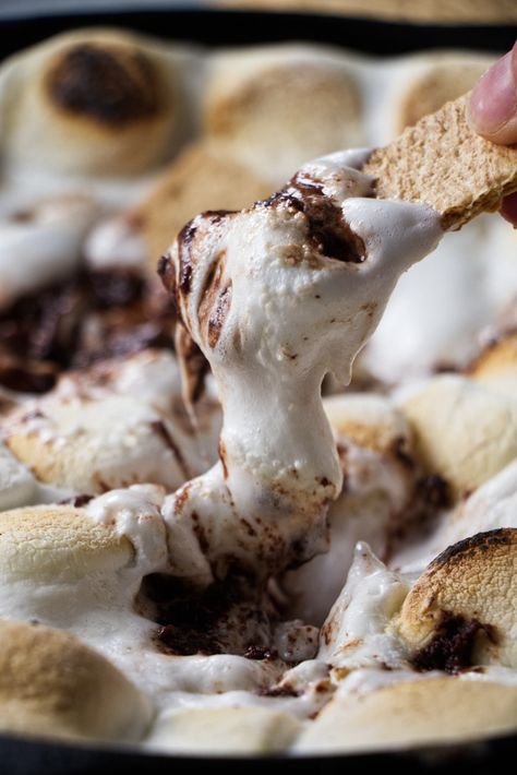 If you've always wanted to bring the campfire experience to your backyard, I have just the solution with this delicious Traeger s'mores dip. This dip is packed with gooey marshmallows, rich melted chocolate, and plenty of sugary goodness. This one-pot wonder promises to be a hit at your next party. Smoked Smores Dessert, Traeger Grill Dessert Recipes, Peep Smores Dip, Traeger Smoked Dips, Smoked Smores Dip, Smores Board Bonfires, Traeger Dip Recipes, Desserts On The Smoker, Pellet Grill Dessert Recipes