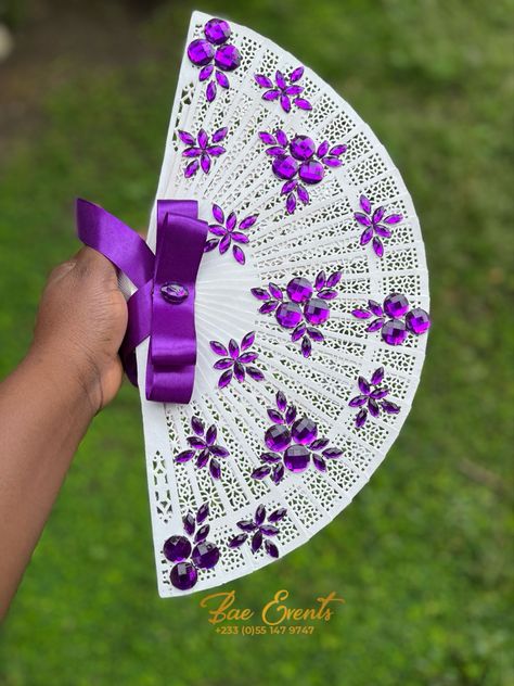 Wooden fan White and violet bridal fan Bridal Fan Bouquet, Bridal Fans Ghana, Bridesmaids Fans, Diy Wedding Fans, Safety Pins Fashion, Bridal Fans, Bridal Fan, African Bridesmaids, Pins Fashion