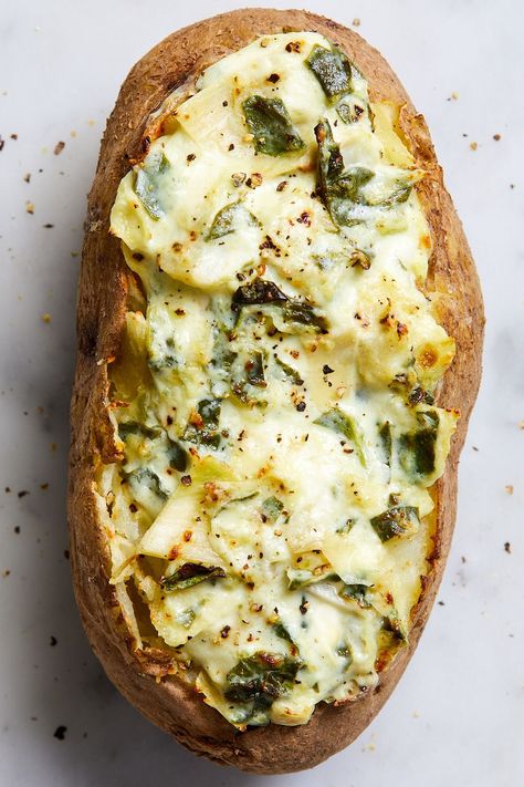 36 Ways You Never Would've Thought Of To Top A Baked Potato Spinach Stuffed Potatoes, Pesto Baked Potato, Vegetarian Stuffed Baked Potatoes, Veggie Stuffed Baked Potatoes, Baked Potato Vegetarian Toppings, Veggie Stuffed Potatoes, Best Baked Potato Toppings, Baked Sweet Potato Dinner Recipes, Healthy Stuffed Baked Potatoes