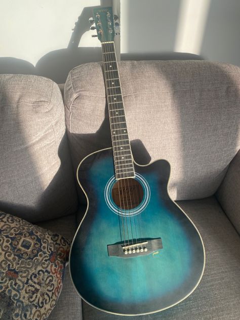 Cool blue and black acoustic guitar! #guitar #acoustic #blue #black #sunlight #trending #aesthetic Blue Acoustic Guitar Aesthetic, Guitar Designs Acoustic, Gutair Acoustic, Pretty Acoustic Guitars, Guitar Acoustic Aesthetic, Cool Acoustic Guitars, Cute Acoustic Guitar, Guitar Aesthetic Acoustic, Blue Guitar Aesthetic