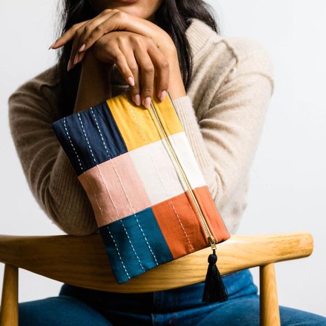 This stylish contemporary pouch is the perfect accessory to complete any look. It features a modern checkered design, intricate kantha embroidery, and a tasseled zipper pull to add a touch of texture. Carry it as a clutch or store away your small essentials. Handmade in India Materials: 1 Layer of 100% GOTS Certified Organic Cotton; Canvas Lined Dimensions: 10 in. W x 7 in. H Care: Spot Clean Only With every product you purchase, you are helping provide employment, educational opportunities and 10 Minute Sewing Projects, Trendy Handmade Pouch Bags, Handmade Casual Pouch Bag, Everyday Handmade Pouch Clutch, Cute Handmade Everyday Pouch, Small Things To Sew, Eco-friendly Handmade Pouch For Everyday Use, Handmade Pouches, Diy Bags Tutorial