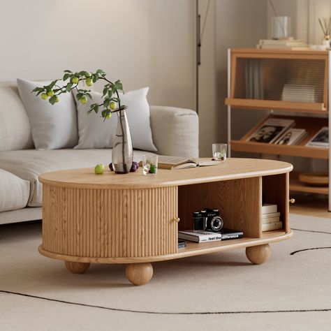 This coffee table features two sliding grooved tambour doors, round wood legs, and metal handle detailing, allowing you to store anything from books to remotes within the flexible compartments. A sleek ash wood countertop brings an adventurous, unique feel to your living room, allowing you to reconfigure the room's style. Constructed of solid Ash wood Kiln-dried wood helps prevent warping, splitting, cracking and developing mildew Featuring a grooved tambour door design Four round column legs pr Fluted Coffee Table, Tambour Door, Tambour Doors, Stemware Storage, Pedestal Coffee Table, Loveseat Living Room, Wood Countertop, Solid Coffee Table, Wood Accent Table