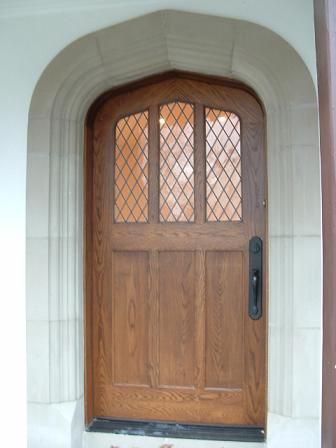 Tudor Artisans - Example Door Surrounds English Tudor Cottage, Arched Front Door, Cottage Front Doors, Plank Door, Cottage Windows, Tudor Cottage, Leaded Glass Door, Stone Architecture, Arched Doors