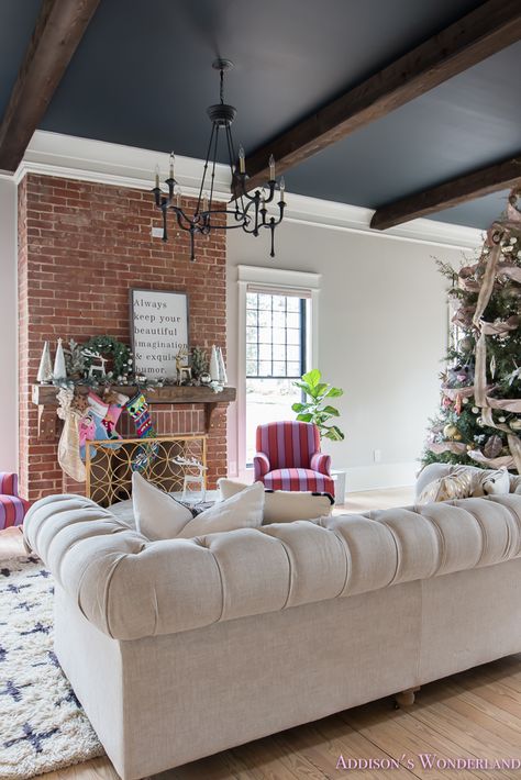 vintage-living-room-black-ceiling-brick-fireplace-dark-wood-beams-anthropologie-home-tufted-sofa-christmas-2-of-23 - Addison's Wonderland Living Room With Dark Beams On Ceiling, Dark Grey Ceiling Living Room, Wood Beams On Ceiling With Crown Molding, Dark Ceiling With Beams, Dark Vaulted Ceiling Living Room, Black Ceiling With Wood Beams, Dark Beams Living Room, Black Beams Living Room, Black Ceiling Living Room