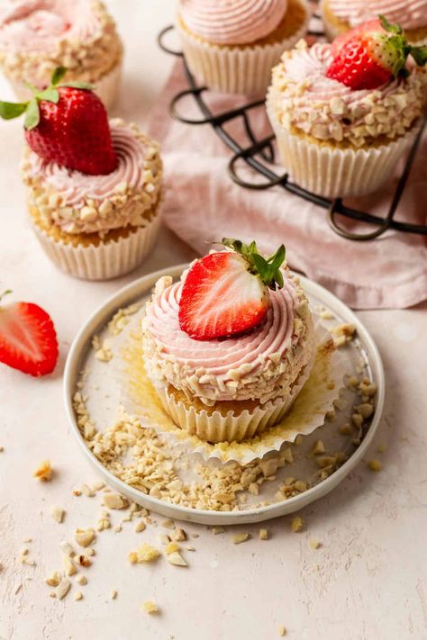 The Best Strawberry Almond Cupcakes | Emma Duckworth Bakes Herbal Cupcakes, Valentine's Cupcakes, Big Strawberry, Almond Cupcakes, Roasted Strawberry, Almond Crust, Lemon Meringue Tart, White Chocolate Shavings, Homemade Strawberry Sauce