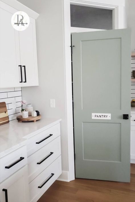 #kitchenrenovation #kitchenreno #kitchenideas Pantry Door Paint Colors, Green Pantry Doors, Pantry Accent Door, White Kitchen With Sage Accents, Accent Door Colors Interior, Colored Pantry Door, Sage Green Pantry Door, Sage Doors Interior, Sage Interior Doors