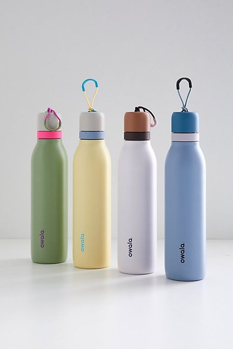 Stay hydrated with our new favorite to-go sipper by Owala. Triple-layer insulation vacuum water bottle with choose your own adventure sipping options with its built-in straw or narrow-mouth opening. The Owala FreeSip is a completely leakproof stainless steel water bottle with a fun colorblocked design we love. Features New favorite stainless steel water bottle by Owala The Owala FreeSip has a twist lid that allows you to sip through the straw or a narrow-mouth opening Convenient hinge loops for easy carrying Triple wall vacuum insulation keeps your beverages cold for up to 24 hours Leakproof vacuum water bottle Content + Care Stainless steel, plastic Food safe Hand wash Not dishwasher, microwave or oven safe Imported Size 24 oz Dimensions: 2.9" dia x 11.9" h | Owala FreeSip Twist 24 oz Wat Drink Bottle Design, Minimalist Water Bottle, Aesthetic Bottle, Water Bottle Aesthetic, Owala Water Bottle, Wedding Guest Gift Bag, Sipper Bottle, Guest Gift Bags, Trendy Water Bottles