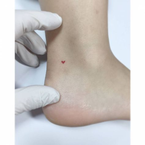 Micro red heart tattoo located on the ankle, Red Heart Tattoo, Heart Tattoo Ankle, Jonboy Tattoo, Love Heart Tattoo, Tattoo Ankle, Red Heart Tattoos, Tiny Heart Tattoos, Ankle Tattoos For Women, Herz Tattoo