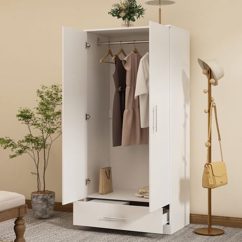 The two-door wardrobe is a beautiful and versatile accessory for any bedroom. It is made of strong and durable high-quality wood. Available in laminated finishes in a variety of colors. Use multiple storage spaces to organize your clothes. It has two doors and can easily open a spacious wardrobe with a hanger that is as wide as the wardrobe. There is a drawer at the bottom of the closet. They have metal slides and safety stops. When the drawer is fully opened, these stops will make the drawer firmly fixed in place. This wardrobe blends well with traditional and modern colors. FUFU&GAGA Contemporary 2-Door Wardrobe with Drawer, Clothes Rail, and Moisture-Proof Base - White Finish, Assembly Required | LJY-KF200167-04 Bedroom Clothes Storage Ideas, No Closet Solutions Bedroom, Drawer Clothes, Kids Closet Storage, Armoire Wardrobe Closet, Armoire Wardrobe, 4 Door Wardrobe, Wood Armoire, Armoires & Wardrobes