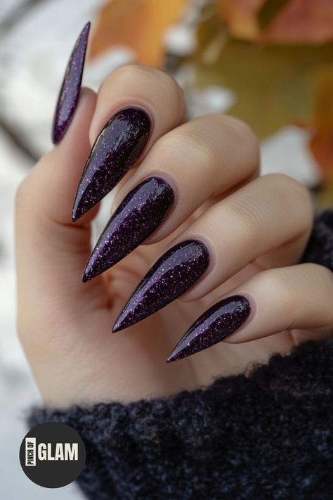 Looking for some spooky nail inspiration? Check out these stunning purple Halloween nails perfect for the season! Whether you prefer a chic and glossy acrylic look, or something more vibrant and playful, these designs are sure to make a statement. From glossy deep purple shades to intricate spider web patterns, there's a style here for everyone. Get creative this Halloween with these eye-catching purple nail ideas that will complete any hauntingly beautiful look. Halloween Inspired Nail Designs, Halloween Nails Purple And Black, Purple Witch Nails, Dark Purple Glitter Nails, Purple Goth Nails, Purple Halloween Nail Designs, Oct Nails, Halloween Nails Purple, Purple Halloween Nails