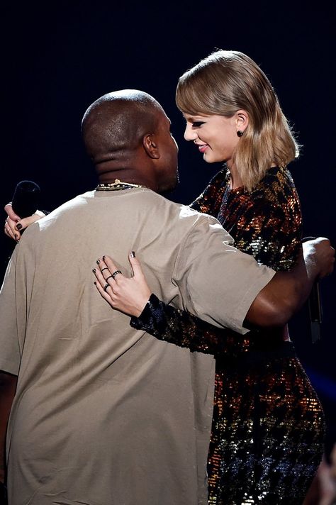 Pin for Later: All the People Taylor Swift Shared Memorable Moments With at the VMAs Kanye West What a difference six years makes! Taylor and Kanye West shared a funny moment together when she presented him with the video vanguard award. Kanye West Holding Paper, Paper Taylor Swift, Kanye And Taylor, Taylor And Kanye, Taylor Swift And Kanye West, Taylor Swift And Kanye, Kanye Taylor, Kim K And Kanye, Taylor Swift Kanye West