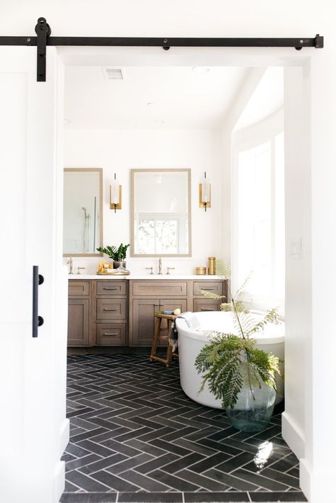 Sourcing: Devonshire Master Bathroom – Greige Design herringbone floors | brass Sconces | free standing bathtub | Oak cabinetry Remodels, Greige Design, Bad Inspiration, Bathroom Renos, Boho Interior, House Bathroom, Beautiful Bathrooms, Bathroom Flooring, Bathroom Renovation