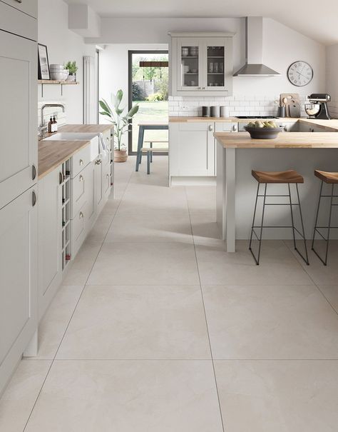 Introducing our exquisite Capri Travertine Stone porcelain floor tiles, a perfect blend of sophistication and durability for your home. Crafted with meticulous attention to detail, these tiles add a touch of class to any room and create a seamless and expansive look for your home. Resistant to stains, scratches, and wear, these tiles offer both style and practicality, making them an ideal choice for high-traffic areas. Elevate your home with the versatility and charm of these premium porcelain floor tiles.  Capri Travertine Stone boasting a soft, neutral hue that effortlessly complements various design aesthetics and seamlessly blends sophistication with durability.     Available in 60cm x 60cm and 80cm x 80cm tile sizes. Kitchen Floors Ideas Tile, Kitchen Living Area Open Plan Tiled Floor, Open Plan Tiled Floor, White Cabinets Stone Floor, Kitchen Floor Tile Design Ideas, Kitchen Floor Lvt, Neutral Interior Design Kitchen, Kitchen With Light Tile Floor, Japandi Kitchen Floor Tiles