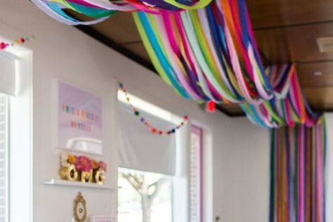 Hanging Crepe Paper Streamers, Decorating With Paper Streamers, Decorating With Crepe Paper, Rainbow Streamers Ceiling, Rainbow Streamers Decorations, How To Twirl Streamers, Crepe Paper Streamers Decorations, Crepe Paper Wall Backdrop, Birthday Streamer Ideas Ceilings