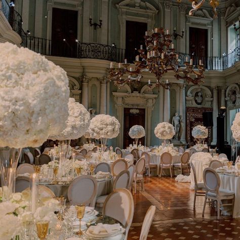 Exuding pure elegance and royalty, this luxury wedding reception features opulent floral centerpieces | wedding, wedding inspo, wedding ideas, wedding decor, weddinh reception, wedding reception decor, royal wedding, royal wedding decor, elegant wedding decor, extravagant wedding, wedding tablescapes, wedding table decor, luxury wedding reception, regal wedding theme, royal wedding theme, wedding table centerpieces, wedding centerpieces #weddingreception #wedding Regal Wedding Theme, Royal Wedding Decor, Royal Wedding Theme, Royalty Wedding Theme, Royalty Wedding, Floral Centerpieces Wedding, Royal Wedding Themes, Luxury Wedding Reception, Luxury Florists